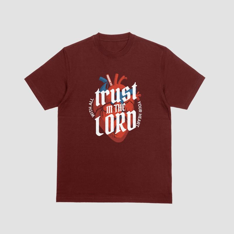 Maroon tee with a 'Trust in the Lord' anatomical heart design (mockup)